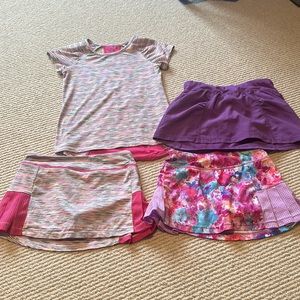 3- Girls Champion sport skirts and 1 top S(6-6x)